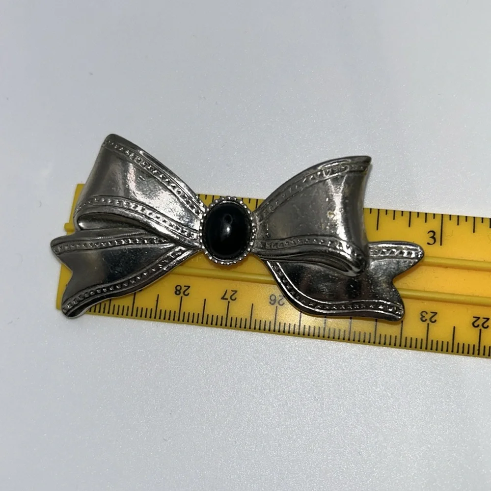 Silver Tone Bow Brooch with Black Center
